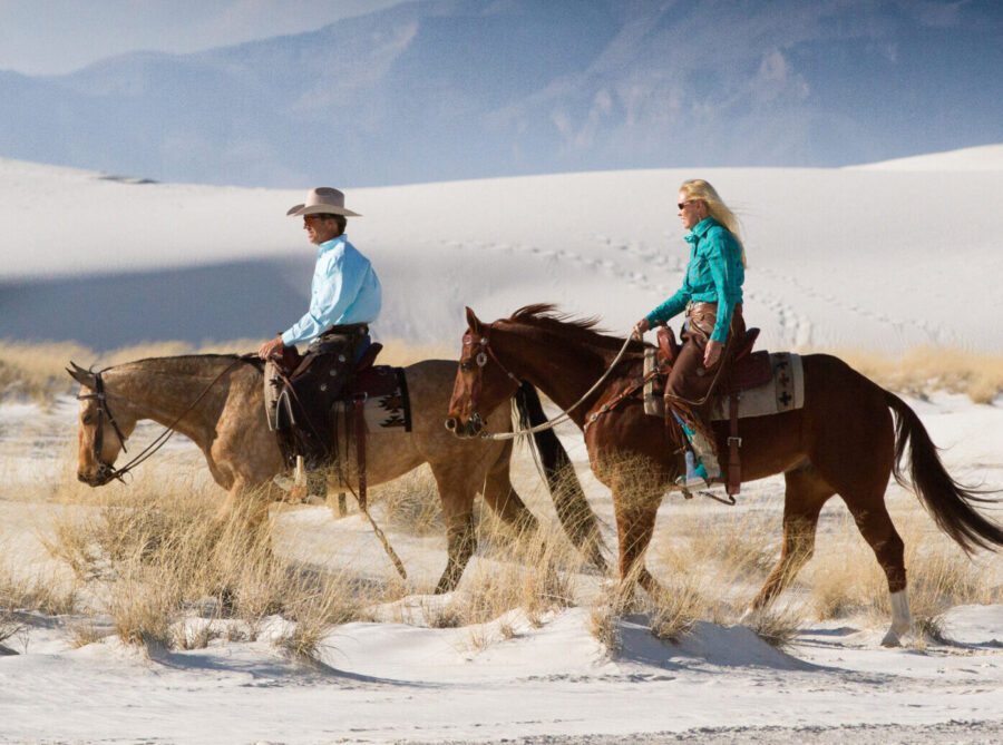 Tracy and David Kaden riding TW Saddlery saddles at White Sands National Monument