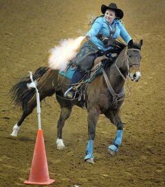 Amanda Rodgers competing in mounted shooting in a TW Saddlery saddle