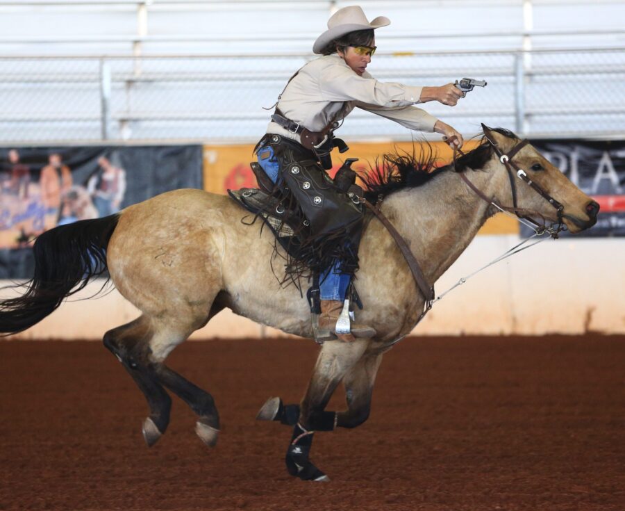 David Kaden competing in mounted shooting riding in a TW Saddlery saddle