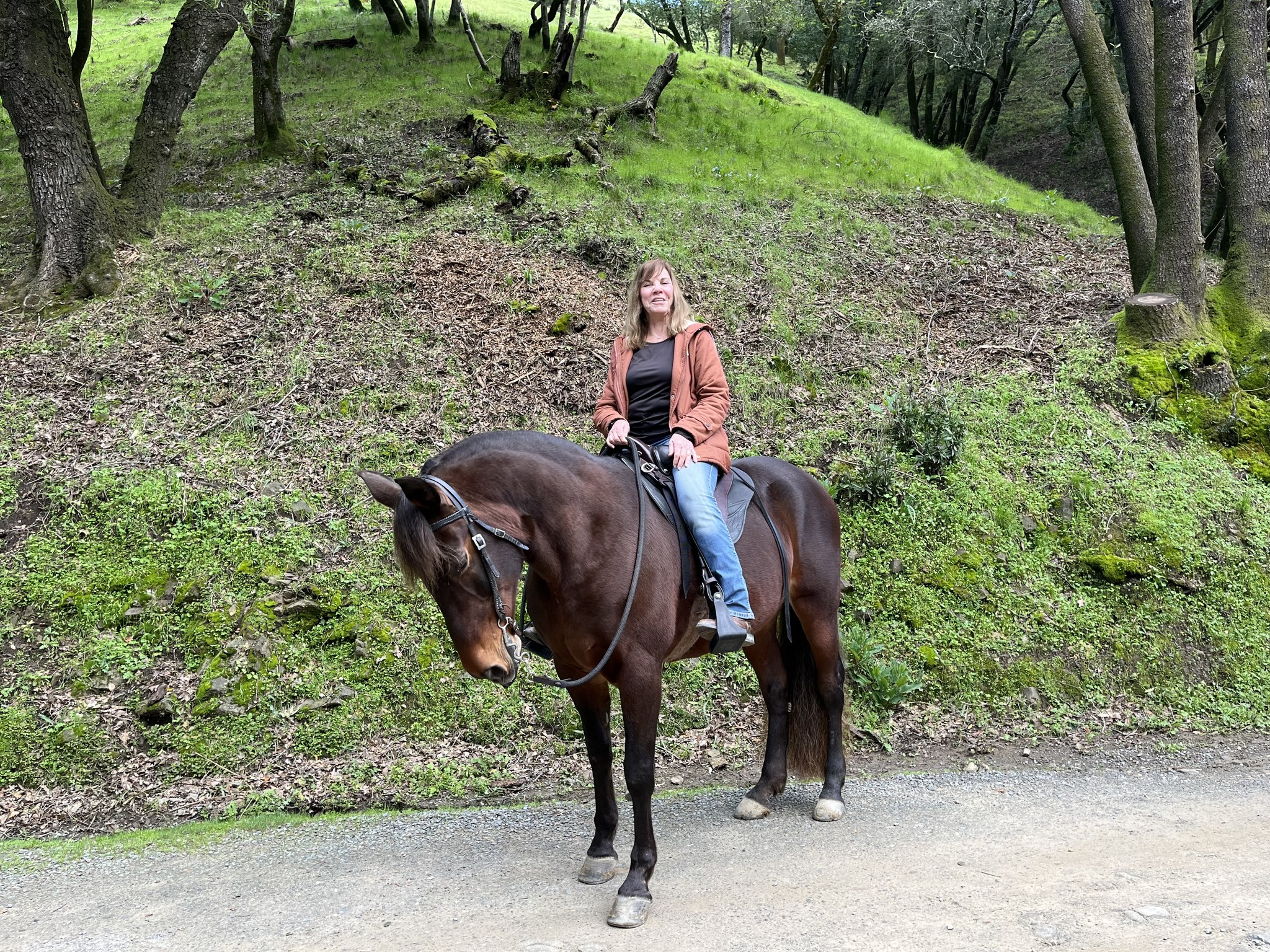 Ann riding her gaited horse Zoey in a Specialized Saddle on the trail