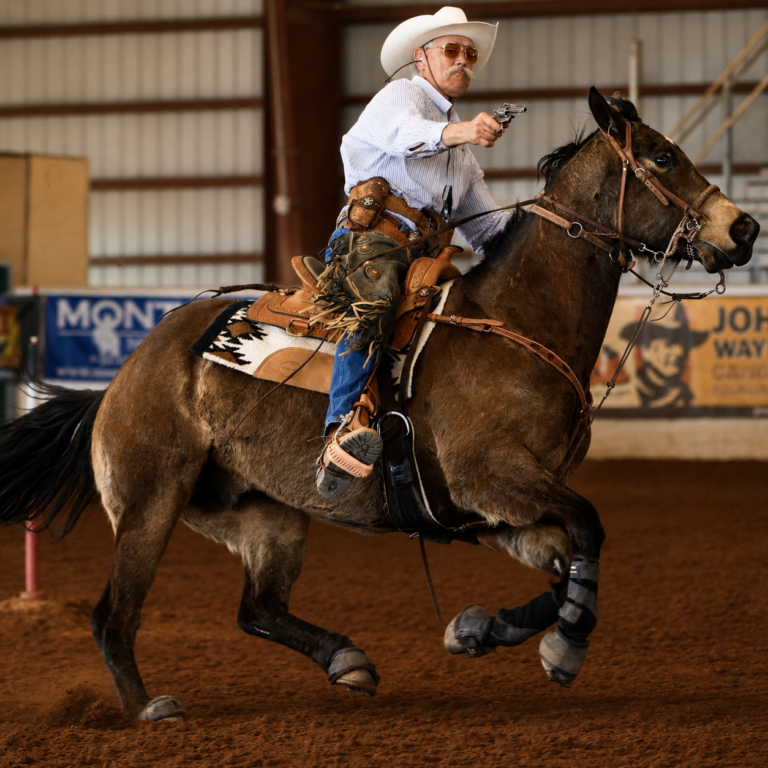 Dr. Donny MacDougall doing cowboy mounted shooting in his TW Shooter saddle.