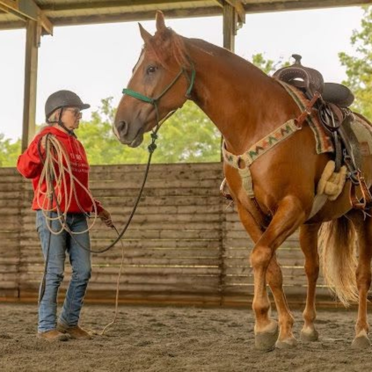 Paula Lawerence in her Featherweight Trail saddle fit by rep Molly Rodgers.