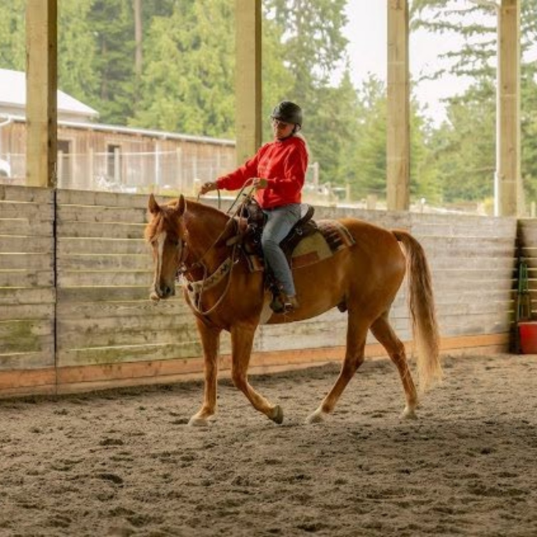 Paula Lawerence in her Featherweight Trail saddle fit by rep Molly Rodgers.