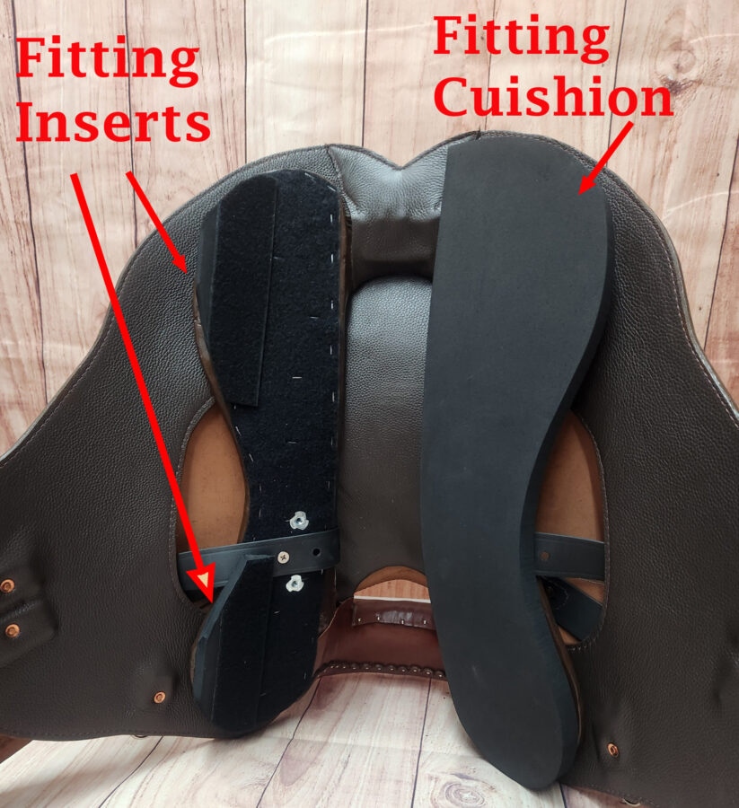 Underside of a TW Saddlery saddle showing the patented Adjustable 3-D Fitting System with interchangeable fitting cushions attached to the tree.