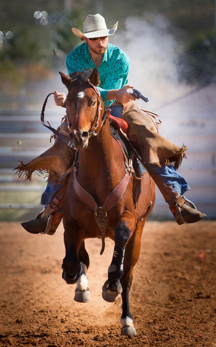 Cole Salopek competing in cowboy mounted shooting in a TW Saddlery saddle
