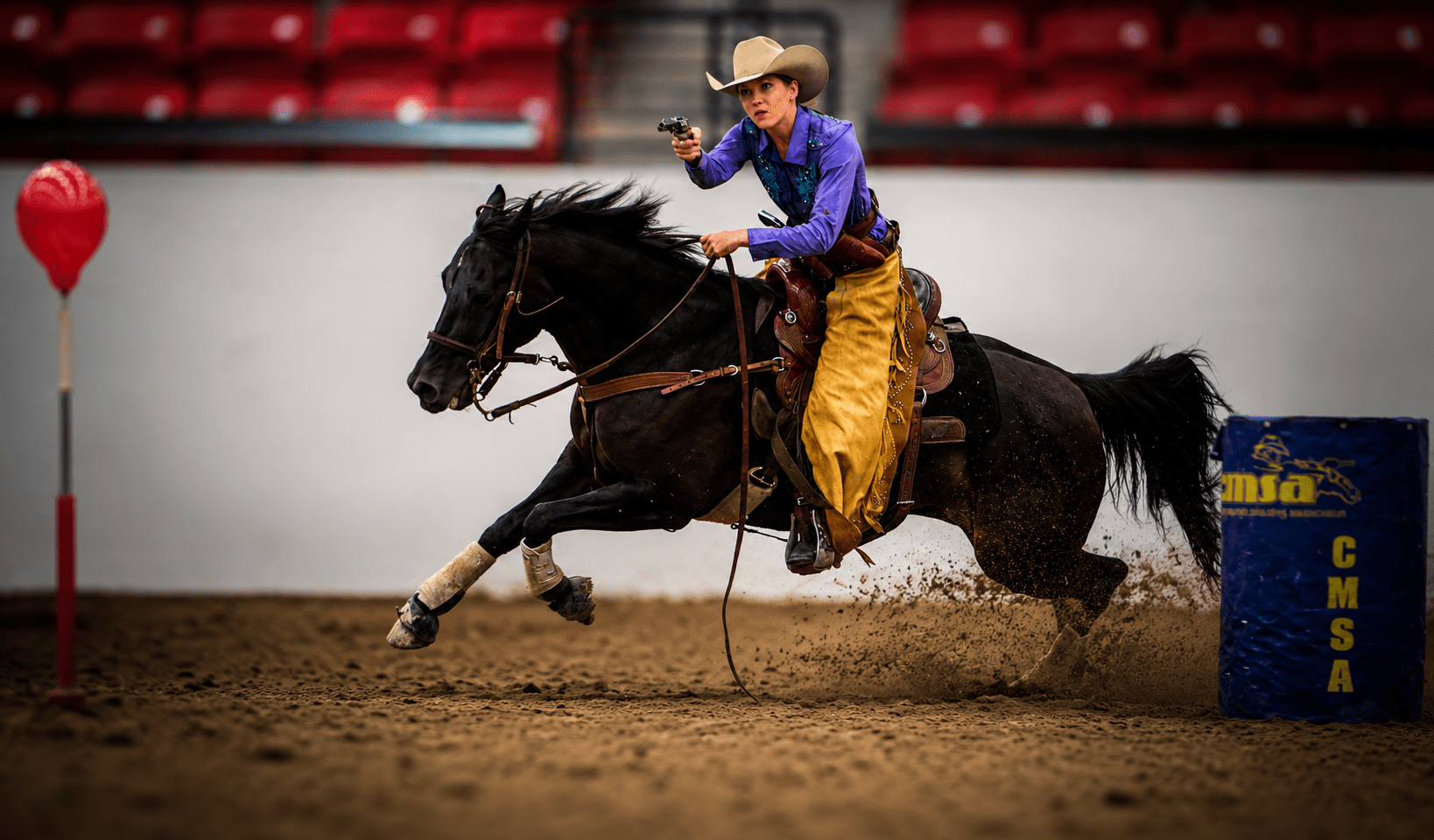 Kate Marley Cowboy mounted shooting horse and rider competing in a TW Saddlery saddle