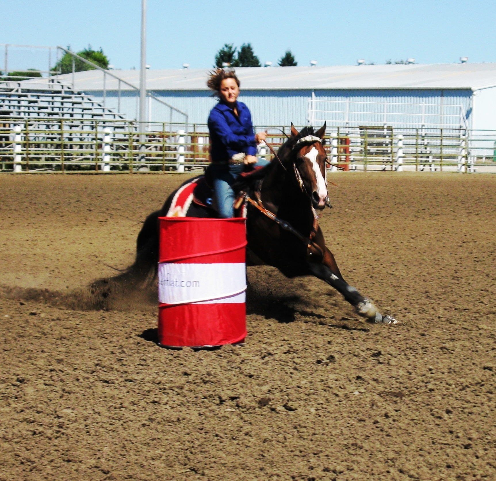 Barrel racing horse and rider competing in a TW Saddlery western performance saddle