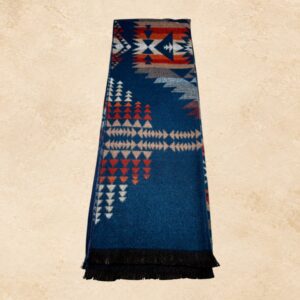 Navy blue Southwestern scarf with red, cream, and gray geometric patterns and black fringe