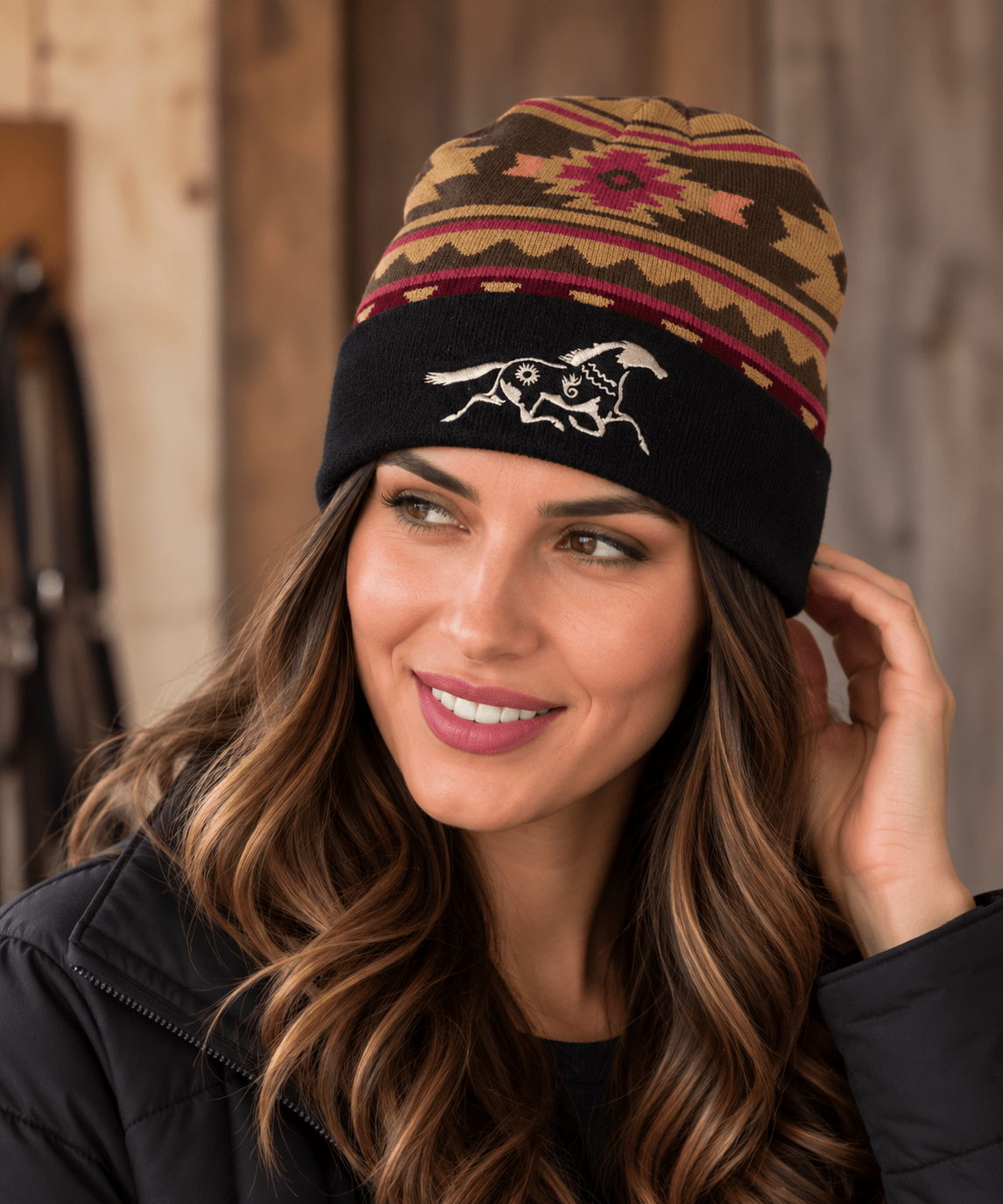 Warm southwestern beanie with brown and burgundy geometric pattern and embroidered white horse on black cuff