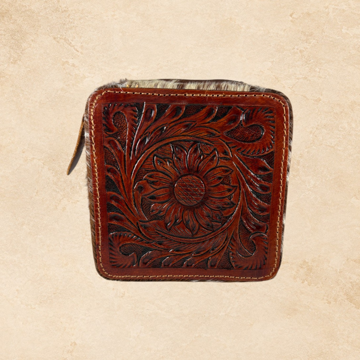Open brown hide jewelry organizer with soft lined interior, divided compartments, ring holders, and removable insert.
