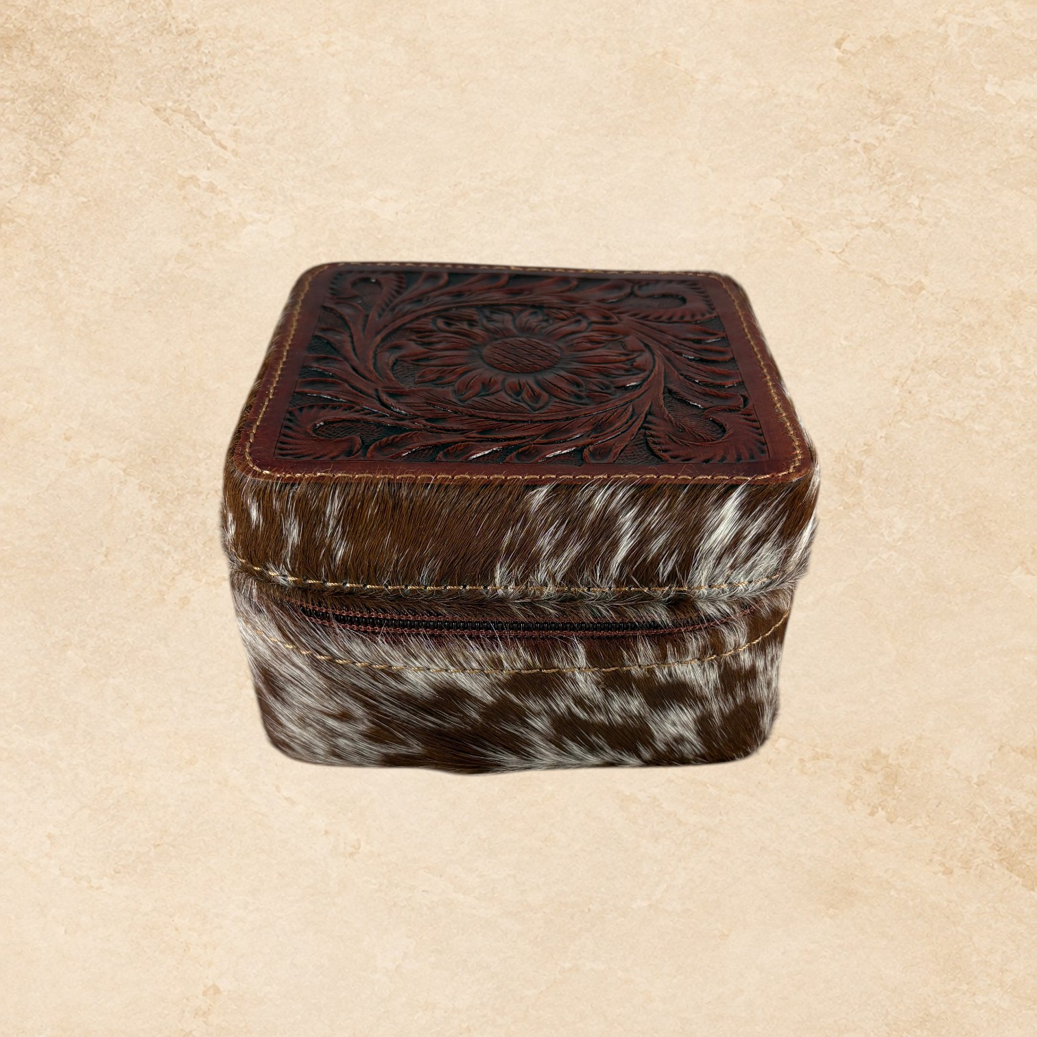 Open brown hide jewelry organizer with soft lined interior, divided compartments, ring holders, and removable insert.