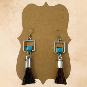 Turquoise Window Horsehair Earrings with genuine dark brown horsehair tassels, turquoise stones, open square silver-tone accents and fishhook ear wires.