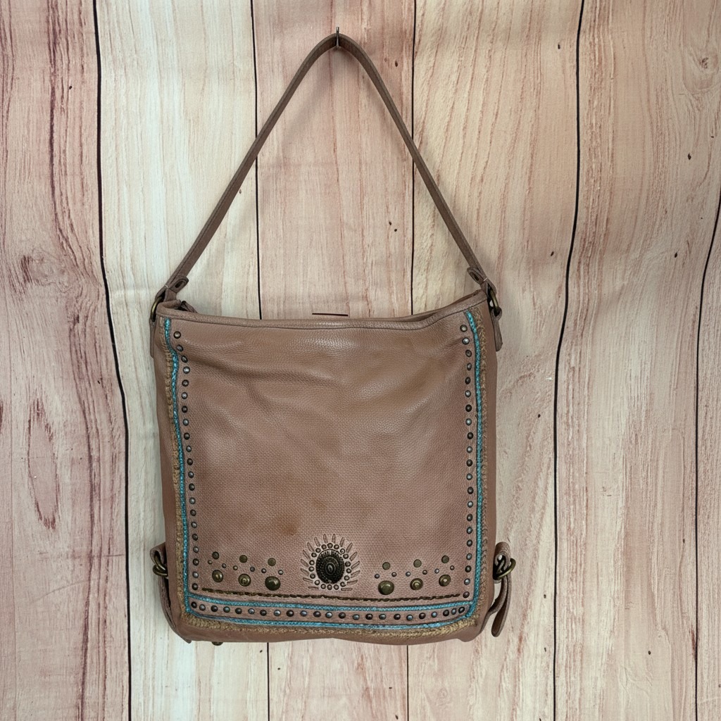 Brown Western purse with turquoise stitching, studded trim, and Southwestern detailing