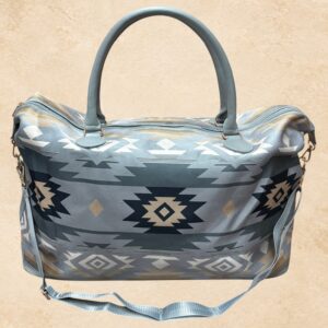 Grey Ridge western weekender bag with grey, black, cream and taupe Southwestern geometric pattern, top handles and shoulder strap.
