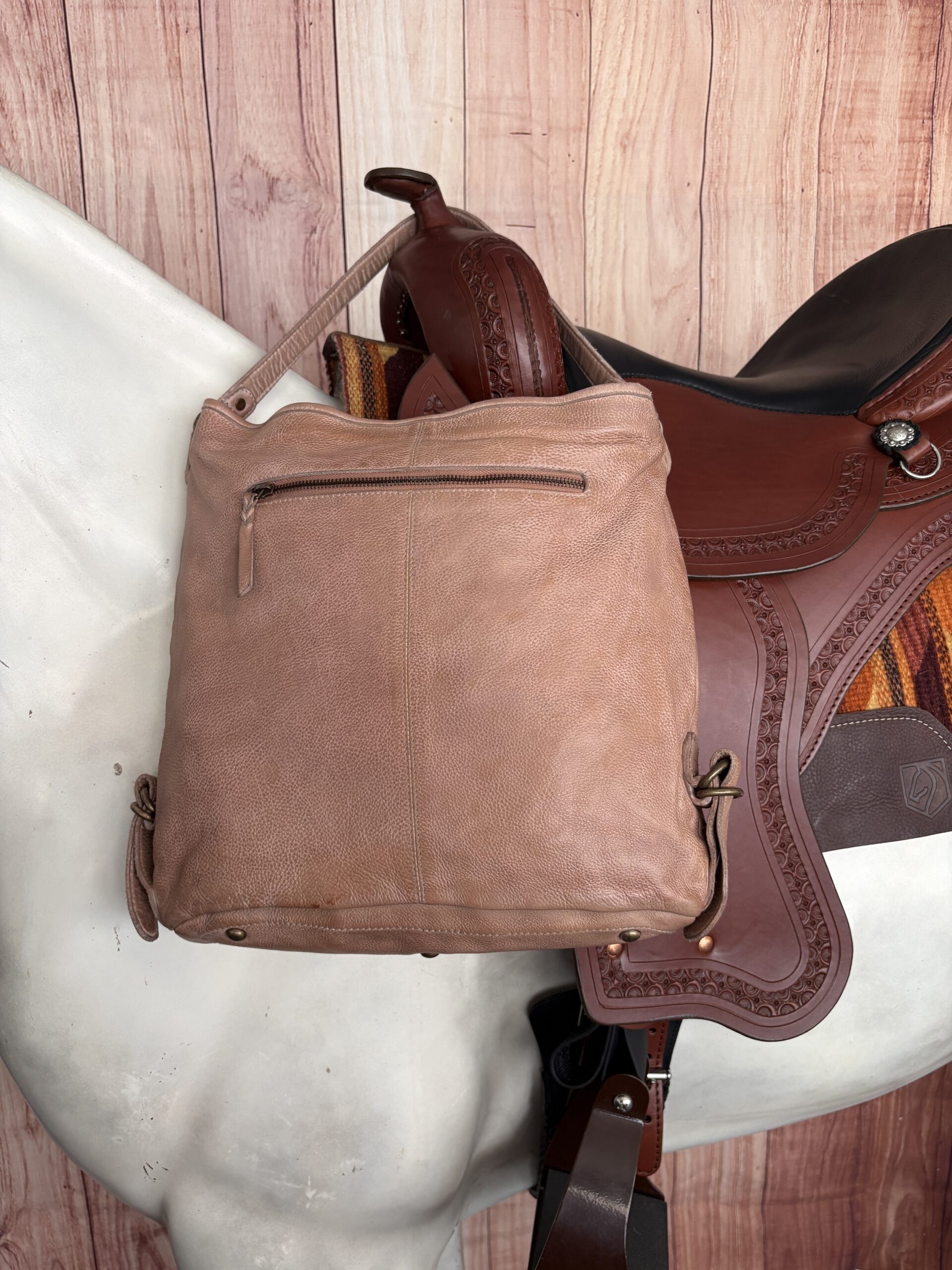 Brown Western purse with turquoise stitching, studded trim, and Southwestern detailing