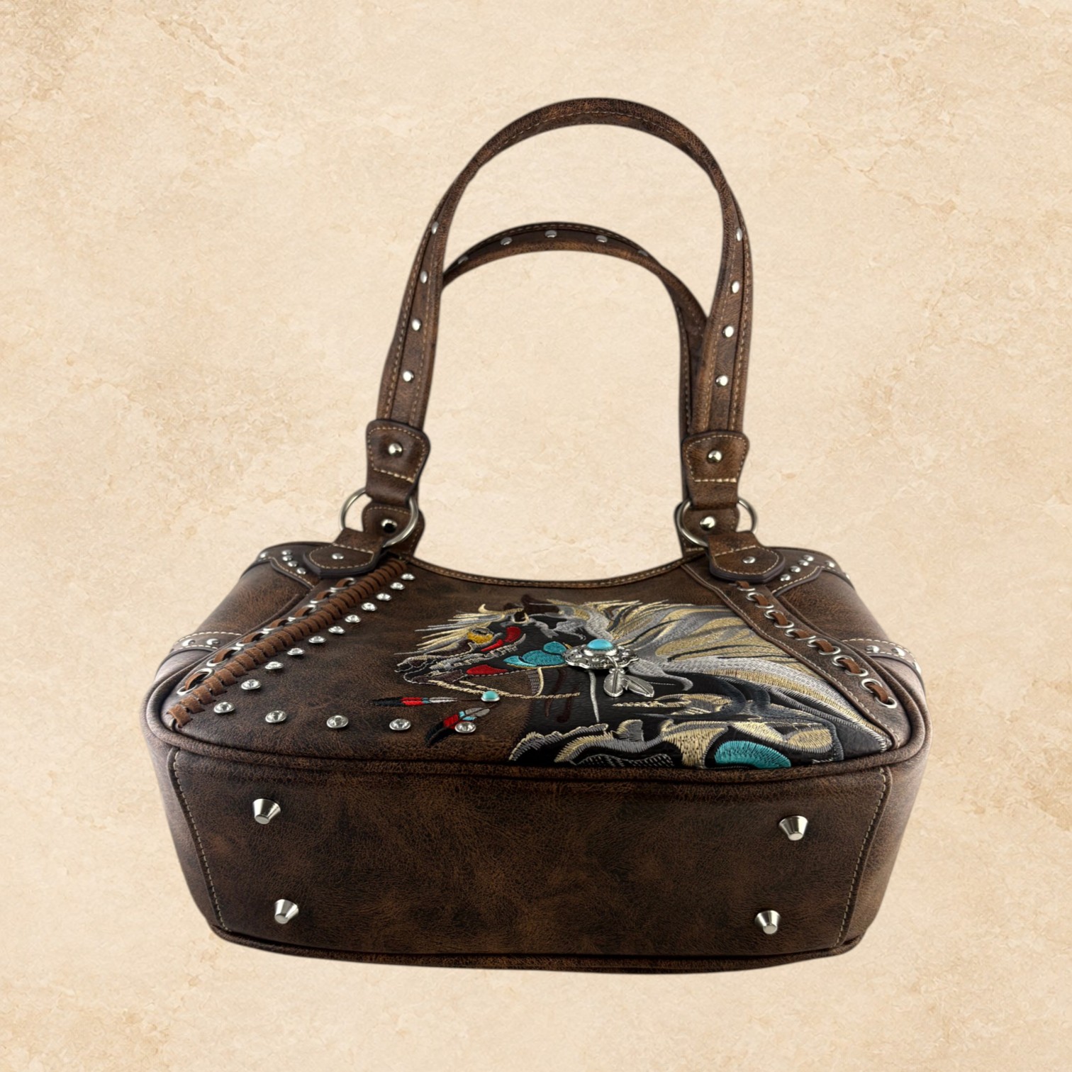 Side view of brown leather horse purse with studded trim
