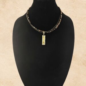 Copper Fire Horsehair Necklace with braided dark horsehair, black, silver, copper and cream beads, silver-tone hardware and mixed-metal arrow pendant.