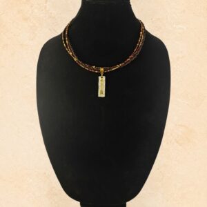 Sundown Arrow Horsehair Necklace with braided brown horsehair, burgundy, copper and gold beads, gold-tone accents and mixed-metal arrow pendant.