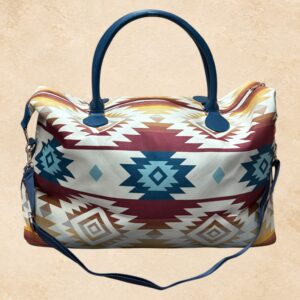 Sedona Sky western weekender bag with cream, burgundy, blue and gold Southwestern geometric pattern, top handles and shoulder strap