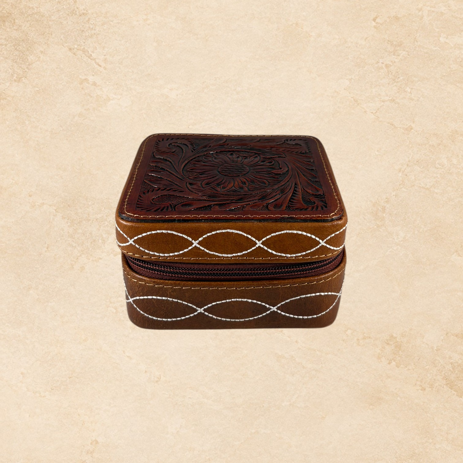 Brown Desert Stitch jewelry box open with soft interior, divided compartments, and jewelry holder loops.