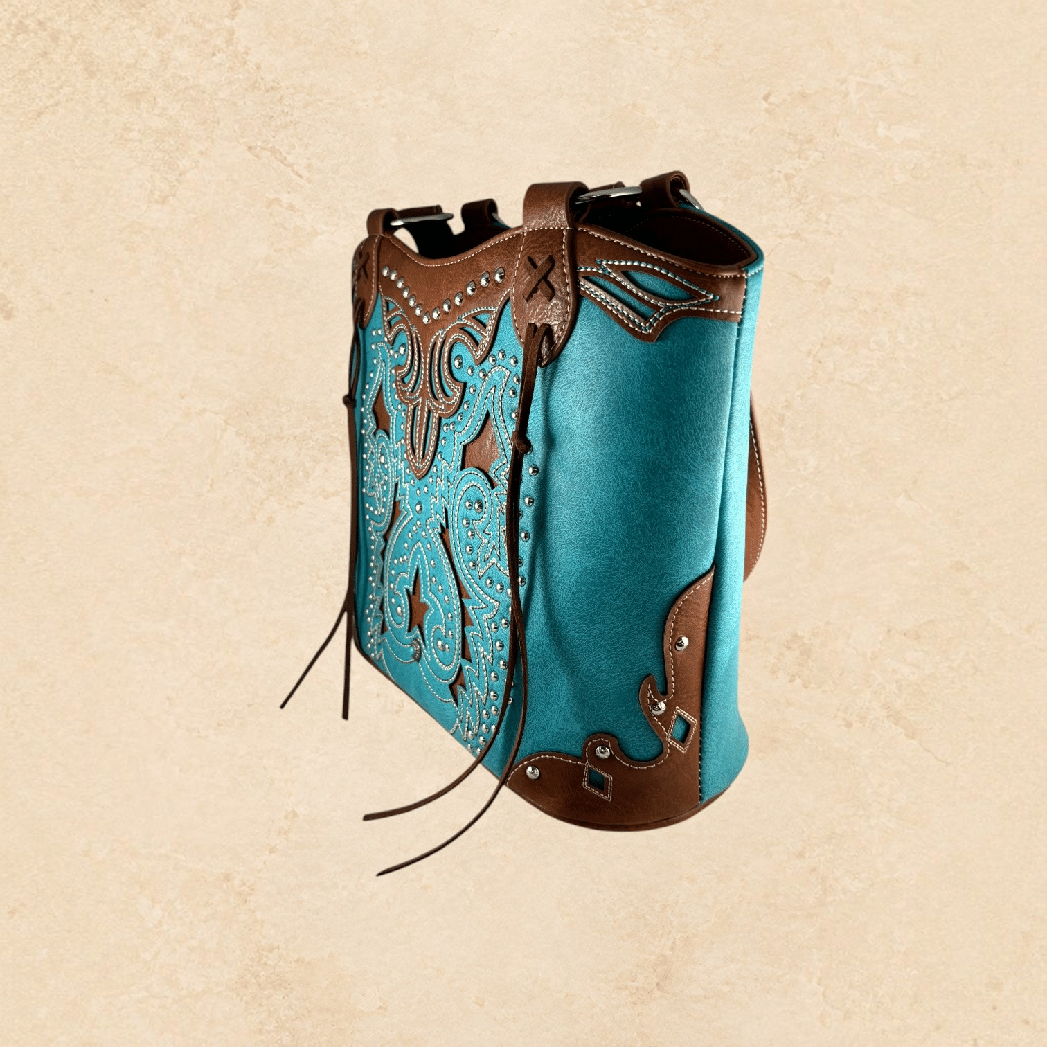 Turquoise and brown purse with intricate Southwestern detailing, silver-tone studs, decorative stitching, and brown leather-look accents.