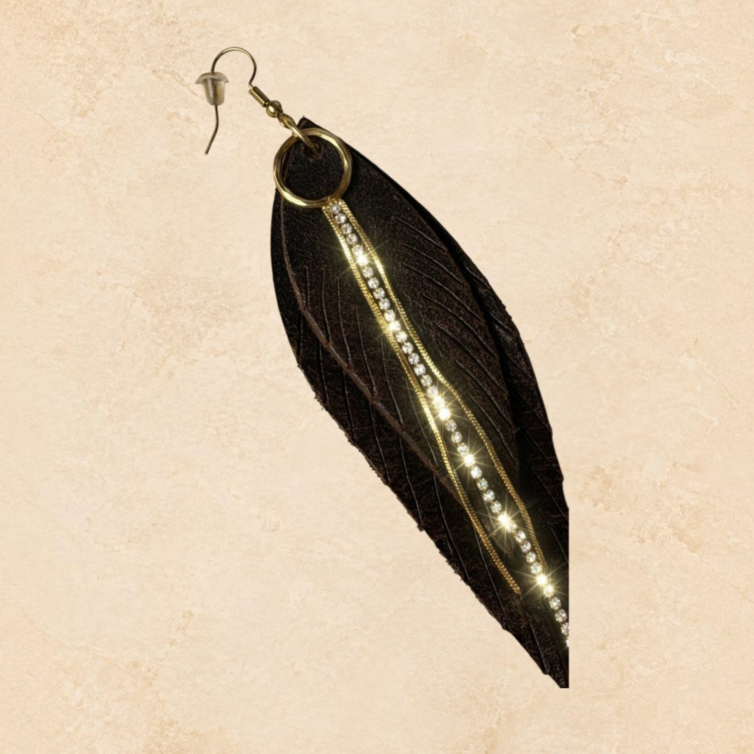 Dark brown feather earrings with gold-tone accents and sparkling rhinestone detailing