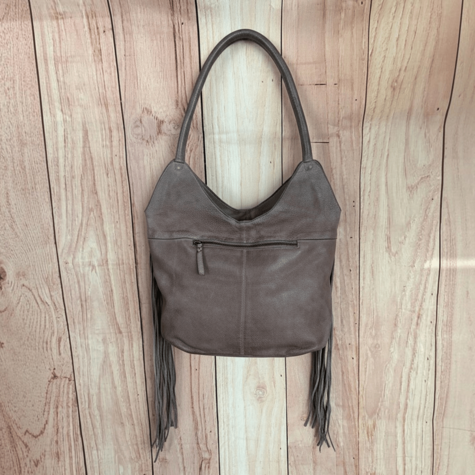 One-of-a-kind handmade taupe leather Western purse with long fringe and turquoise detailing