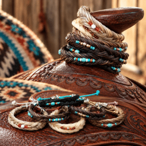 Hand-braided horsehair saddle horn jewelry with colorful Southwestern bead accents in natural horsehair shades.